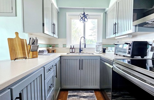 Bluffton House | Lakefront cottage on Muskegon Lake! Fire pit, 40' BOAT DOCK, near beach, shops