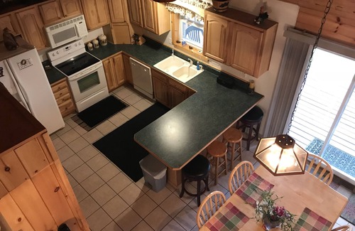 Wetmore Cottage | Lakefront, covered deck, huge backyard with grill, swimming, boat & kayaks!