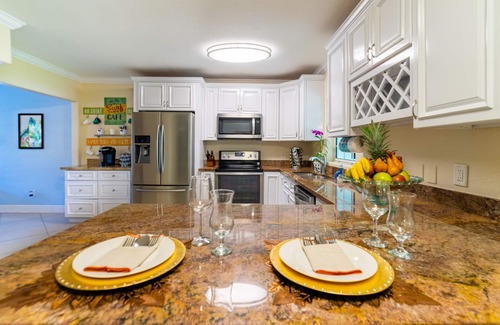 Lake Worth House | Lakefront Oasis 6BD, Sleep 14, Heated Pool, Tikis, Golf, Dock on Lake, No Stairs