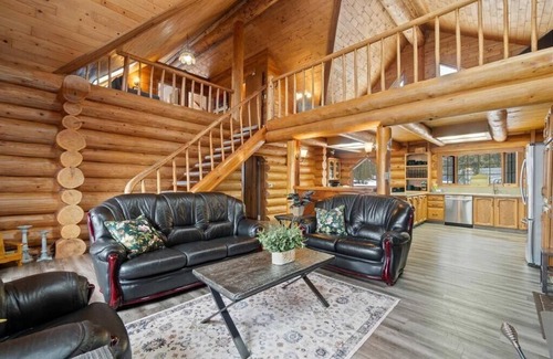 Magna bay Ski Chalet | Lakeview log cabin for large groups, 4 season fun! Beach access, buoy, hot tub