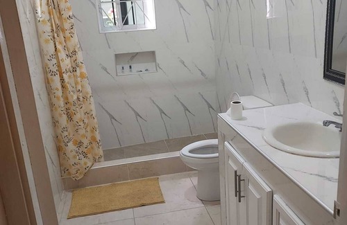 May Pen House | Large spacious 2 bedroom 2 bathroom, secure garage family house.