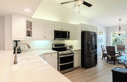 Naples Condo | Large updated lanai overlooking the heart of the water at Magnolia Falls.