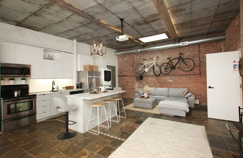 Leslieville Apartment | Leslieville LOFT with Wood Burning Fireplace and Skylights! Parking Included.