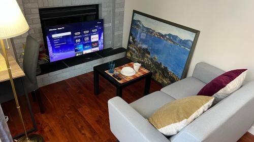 Southwest Calgary House | Lily room near golf and banff costco newly renovated queen size bed Single bathroom sofa TV
