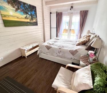 Nova Bystrice Apartment | Log cabins at Iron Rose in Czech Canada