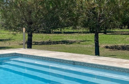 Gontaud Apartment | Look forward to a vacation in beautiful surroundings in this vacation apartment with pool.