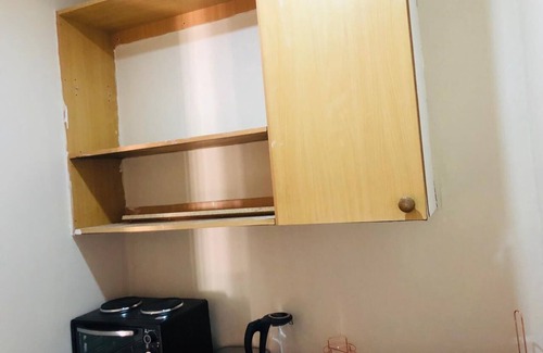 Randpark Ridge House | Lovely Studio Apartment sitting on a lovely acreage with natural man made rocks.
