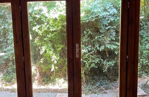 San Martino in Rio Cottage | Lovely wooden accommodation surrounded by greenery