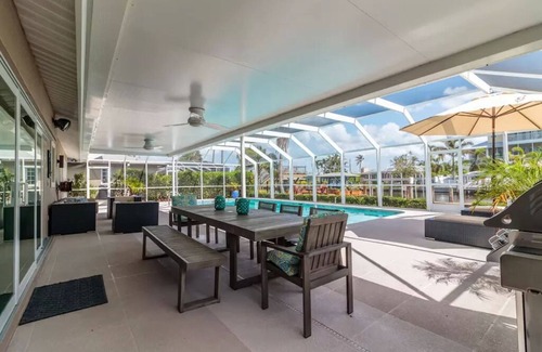 Isles of Capri House | Luxurious Waterfront Retreat! Oversized Heated Pool and expansive outdoor area!