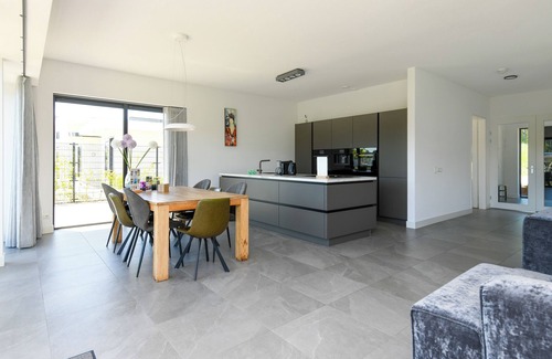 Zeewolde House | Luxury 16-person villa by the water. Two spacious villas with hot tubs, Finnish saunas, private jetties, large terraces, and modern kitchens.