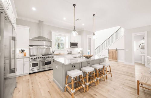 Vilano Beach House | Luxury beach escape, 2 blocks to the ocean & 1 block to the river! Enjoy a heated pool, hot tub, paddle boards, kayaks, golf cart & more—only 10 mins to downtown St. Augustine. Very clean, well stocked & perfect for couples, families & small groups.