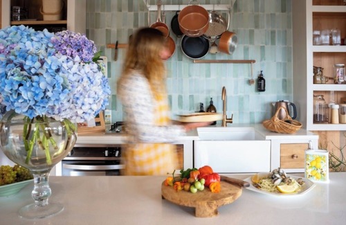 Pouto Cottage | Luxury eco-design waterfront fishing Batch with guests' vegetable garden.