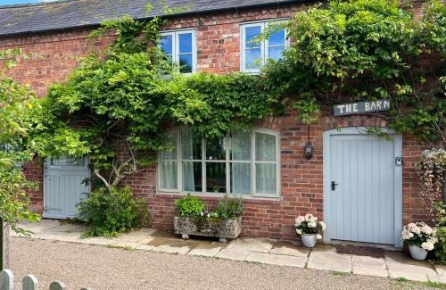 Overton-on-dee House | Luxury homely open-plan Barn with log burner & games room