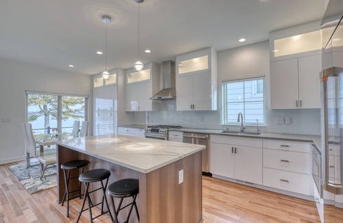 Pewaukee House | Luxury Lakefront Home w Miles of Lake Views, private pier, lake toys & game room