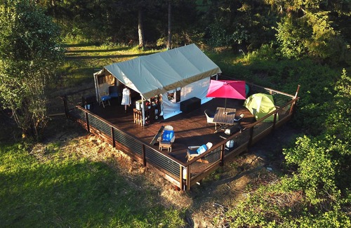 Campbell River RV Rental | Luxury Safari tent adjacent to the beach, following a nature trail to the river