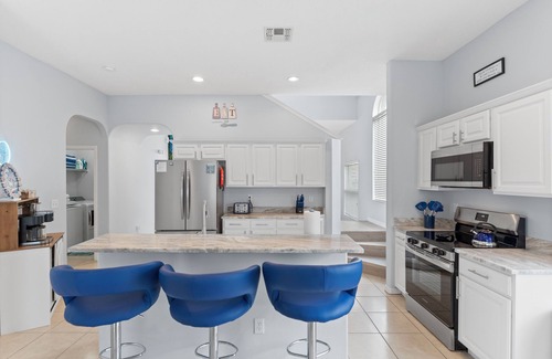 Sunrise Lakes House | Luxury Stay Near Disney Private Pool Hot Tub & EV Charger at Blissful Blue Oasis