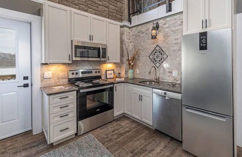 Inner Harbour Apartment | Luxury, top floor suite with free parking space. Walking distance to downtown!