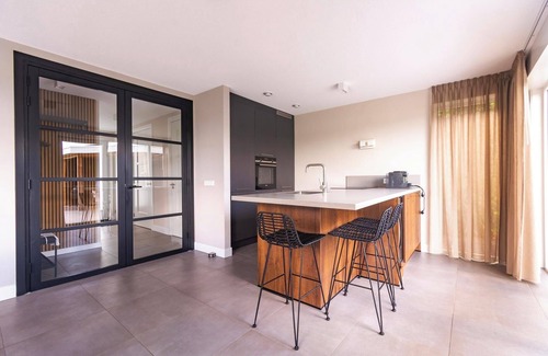 Westerhaar-Vriezenveensewijk House | Luxury wellness vacation home by the water with a private beach