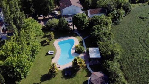 Mezin Villa | Maison de village -8 pers- Piscine chauffée & cuisine d'été en Gascogne