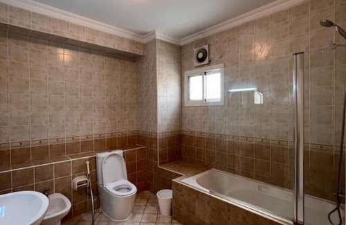 Doha Apartment | Master bedroom with entertaining facilities & Swimming pool
