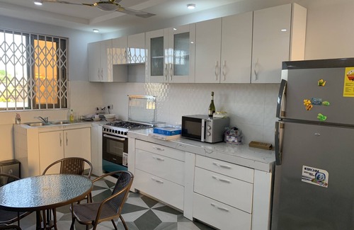 Cape Coast Bed & Breakfast | Modern 2 bed apartment with balcony, kitchen and air-con. Close to castle tours