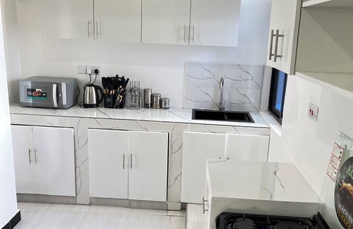 Masaki Apartment | Modern 3BR Hideaway in Masaki | Pool, Gym & Prime Location