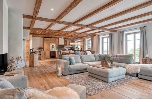 Frasdorf Apartment | Modern chalet style with private sauna, fireplace, hot tube, pool with Chiemsee view