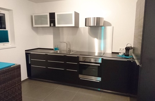 Wollbach Apartment | Modern & comfortable vacation apartment with own entrance, large balcony. Terrace & own PP