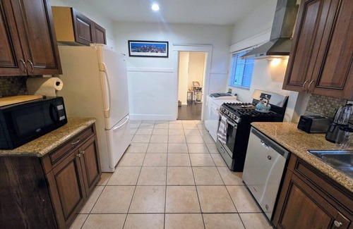 South Wrigley House | Modern Comfy Gem: 5 star Location, with Yard & Parking