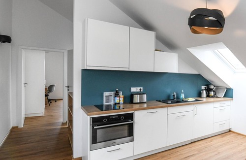 Waggershausen Apartment | Modern, cozy penthouse with large south-facing terrace and mountain views.