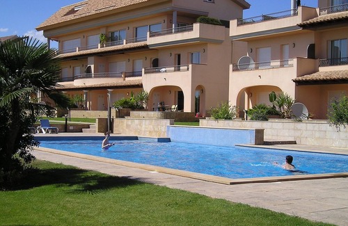 San Jorge House | Modern duplex house overlooking communal pool and gardens at Golf Panoramica.