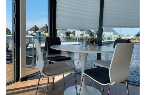 Offingawier Boat Rental | Modern houseboat in Offingawier with terrace