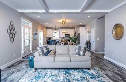 Ingles House | Modern lakefront home with wraparound decks, firepit, and stunning water views on both levels.