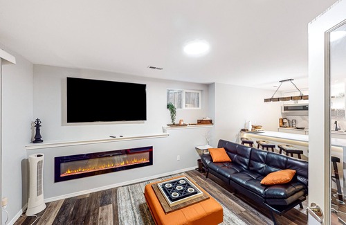 The Wedge House | Modern lower-level getaway with a fireplace, inviting patio & washer/dryer