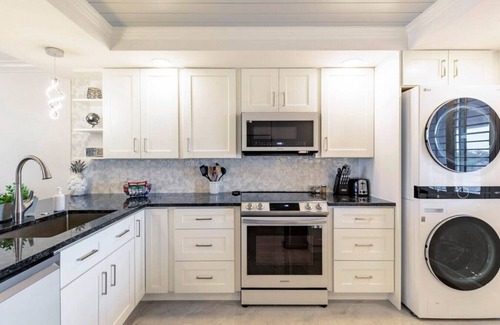 Jupiter Bay Condo | Modern Luxury, Waterfall, Pool, 1/2 mile to Beach