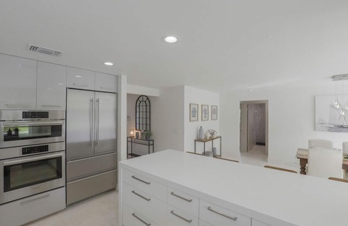 Moorings House | Modern Oasis: Private Beach Access. Minutes from Downtown & Optional Golf Cart