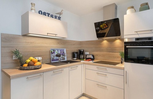 Ostseebad Prerow Apartment | Modern suite in the Apartmenthaus am Park for 2 people, with sauna and fireplace in the house