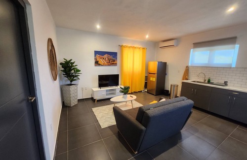 Tera Kora Apartment | Modern sunshine yellow apartment with nature views