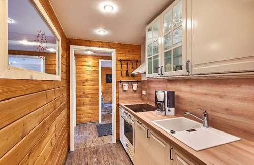 Haus im Wald Apartment | Modernes und gemütliches Holzhaus mit Kaminofen