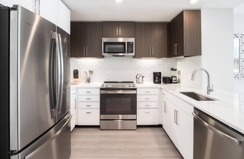 Woodmont Triangle Apartment | Near Bethesda Station | Balcony & Rooftop Terrace | McCrillis Gardens Nearby | by GLS