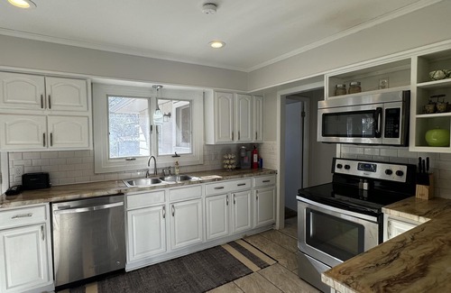 Wichita House | Near WSU: Bumper Pool and Fire Pit! Hosted by Homes by CNJ