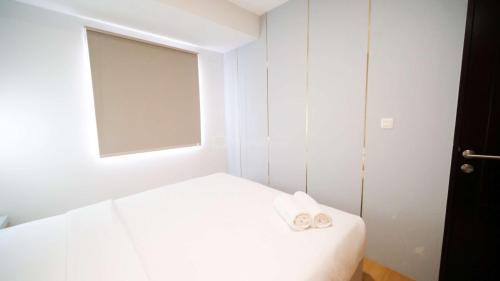 Sidoarjo Apartment | New and Homey 2BR Apartment at Suncity Residence By Travelio