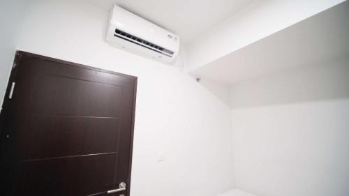 Sidoarjo Apartment | New and Homey 2BR Apartment at Suncity Residence By Travelio