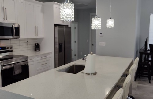 Trafalgar House | New Construction - Elegant Fresh Water Canal Home w/Heated Pool