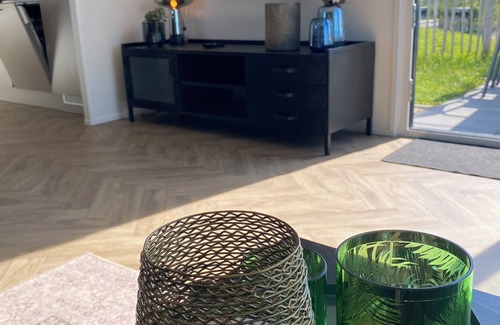 Municipality of Kampen House | NEW Elegant waterfront chalet with jetty Lake Kampen Netherlands vacation home boat
