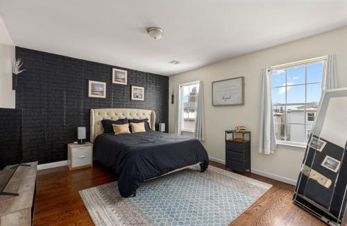 Newark House | Newark Gem 6BR, 5BA - Sleeps 24 - Walk to Prudential Center and Newark Penn Station, Near EWR and American Dream Mall, includes Parking - WiFi - Laundry - Backyard - Gym