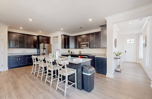 Seaford House | Newly built riverfront home with dock, kayaks, basketball court, & game room