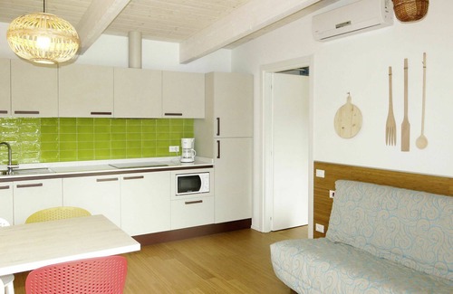 Bibione Lido dei Pini Apartment | Nice apartment for 7 guests with WIFI, A/C, pool, TV, terrace, pets allowed and parking