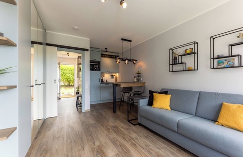 Wenningstedt-Braderup Apartment | One room and many possibilities: the high-quality couch invites you to c