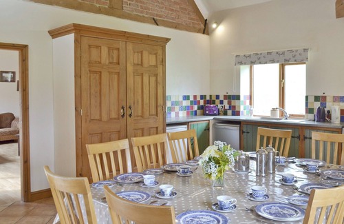 Denstone Cottage | One of two barn conversions with exposed beams and trusses.